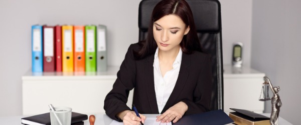 A legal secretary working at her desk.