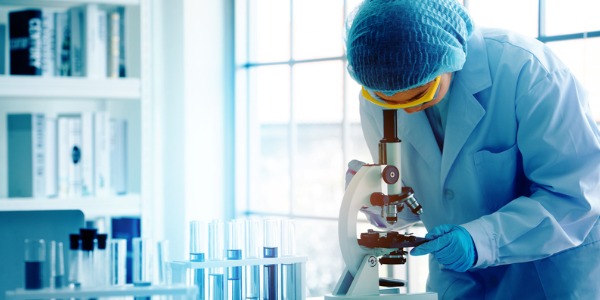 A pharmaceutical scientist testing compounds in a laboratory.
