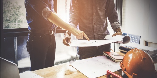 Two sustainable architects discussing a project.