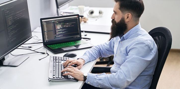 A cloud architect working at his desk.