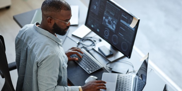 A security engineer working on his computer.