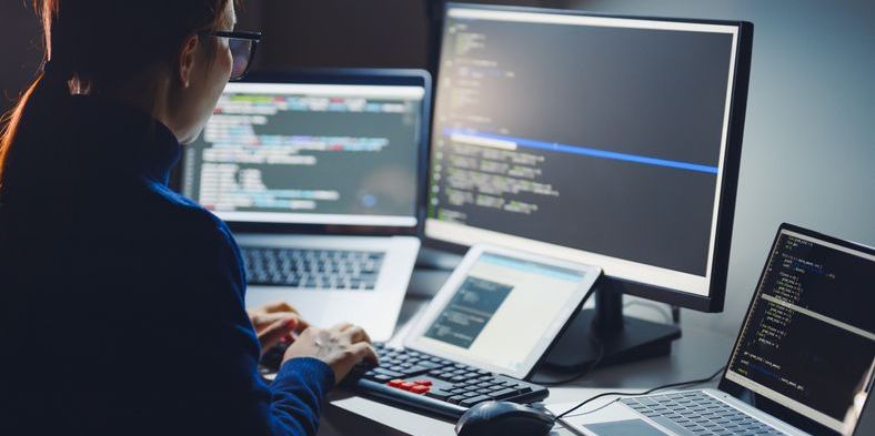 A cloud engineer working on her computer.