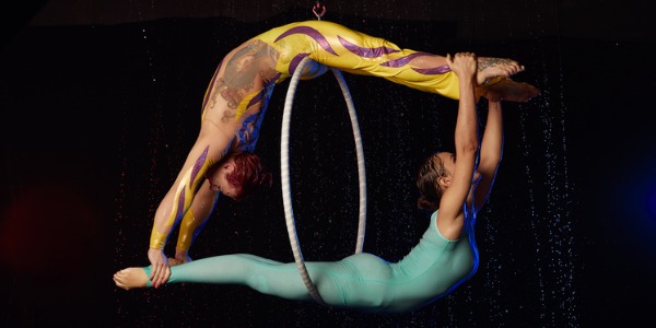 Two aerialist circus performers.